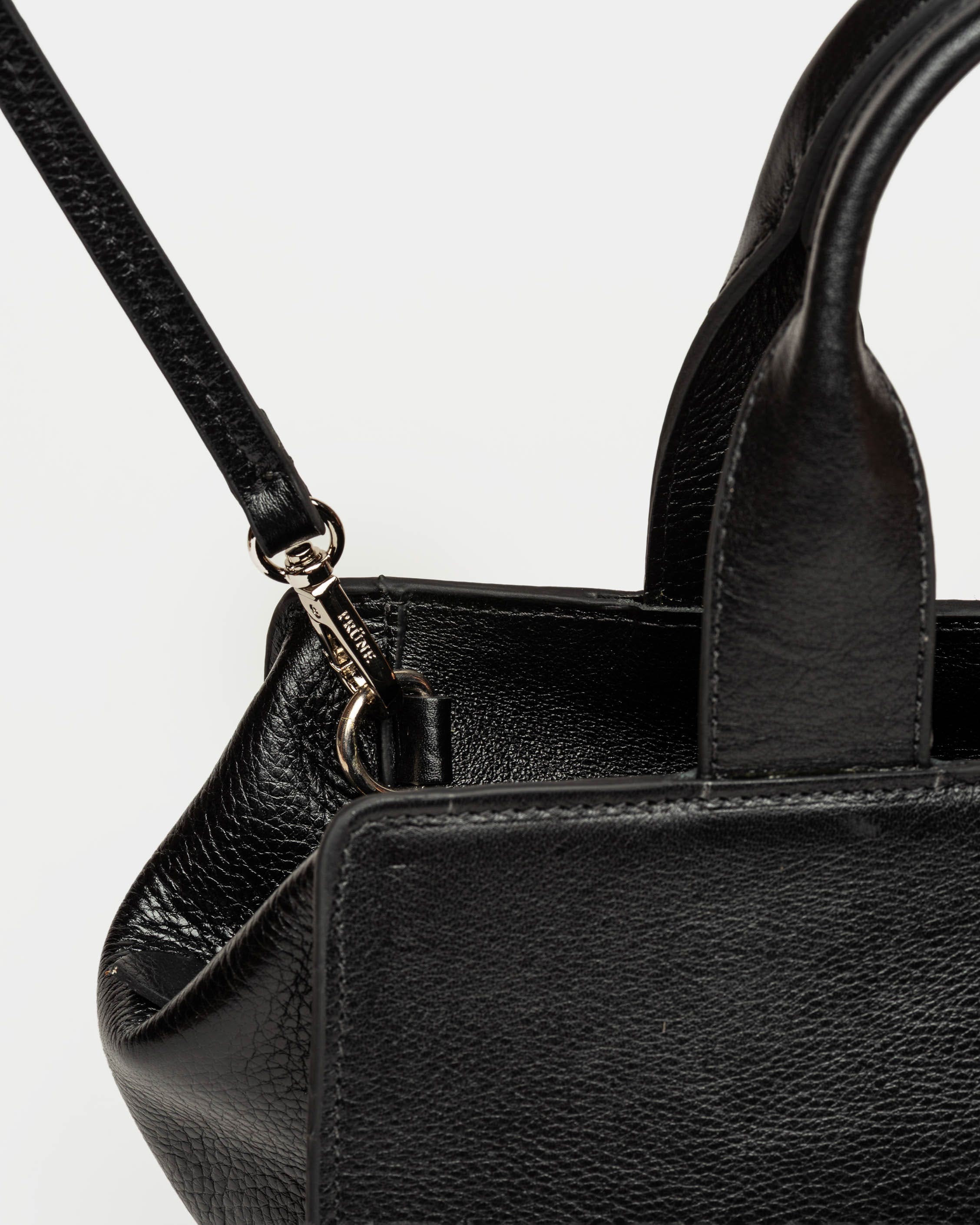 Cartera de mano Mila en cuero liso